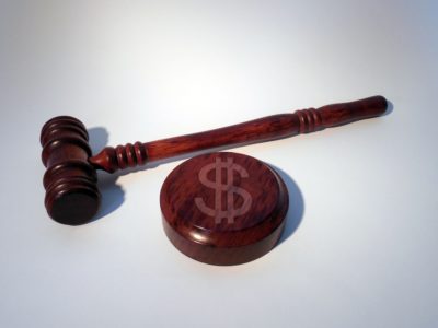Gavel and dollar sign from arbitration dispute